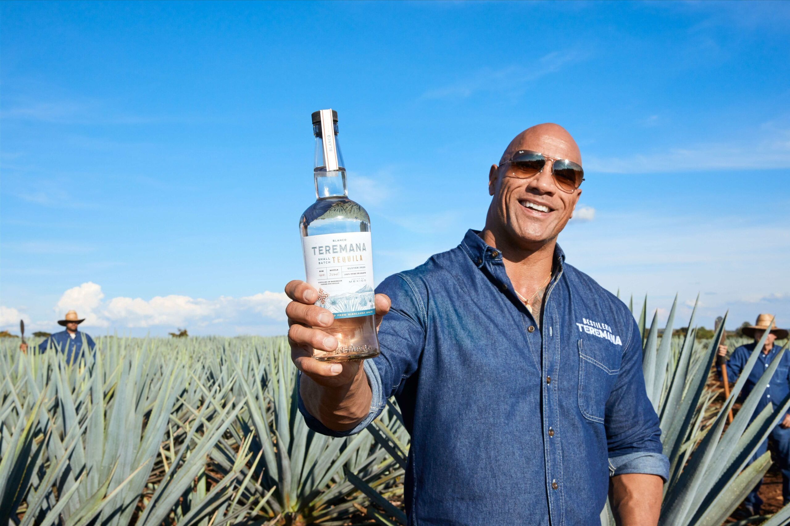 Dwayne Johnson holding a bottle of Teremana