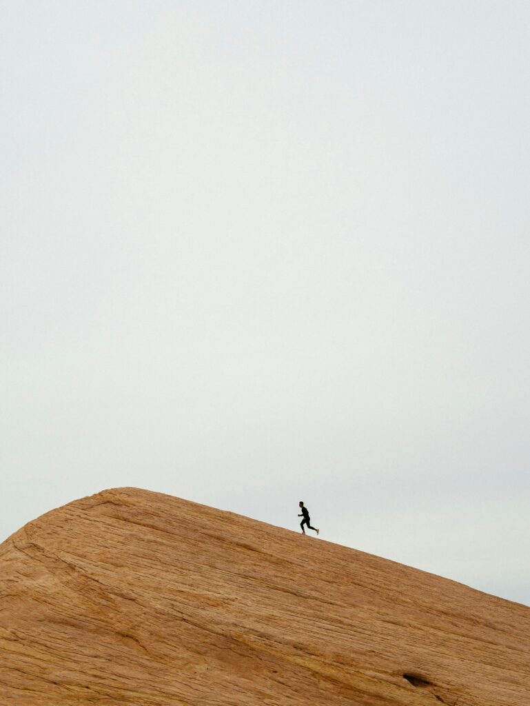 man running up hill