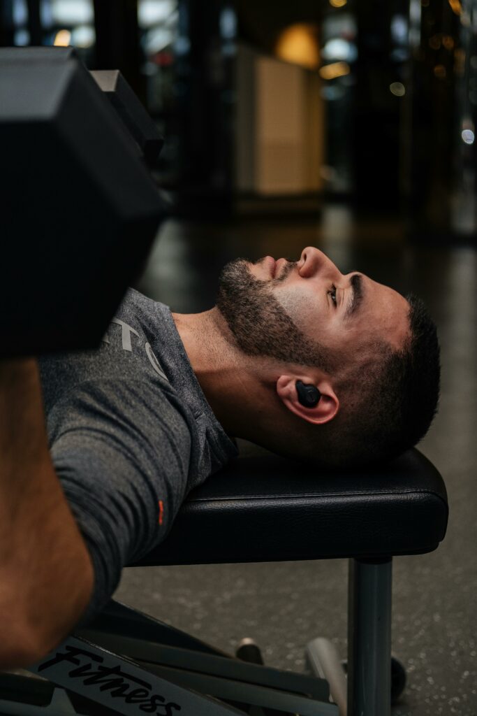 Man working out Earbuds scaled