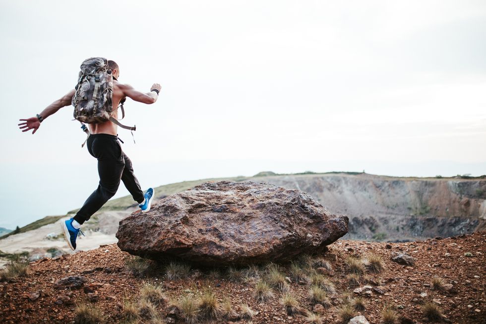 muscular man running on mountain royalty free image 1697703063 1